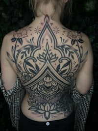 a woman with a tattoo on her back